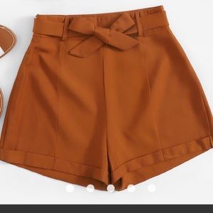 High-waisted rust color shorts